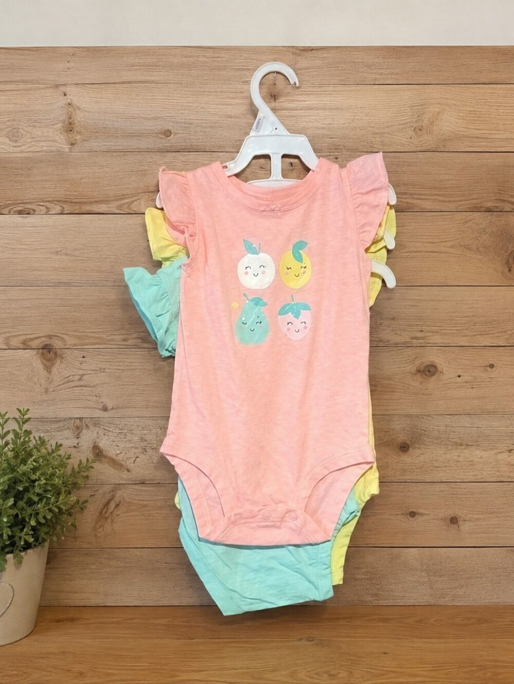 Size 9M baby girls Carter's three piece onesie bundle